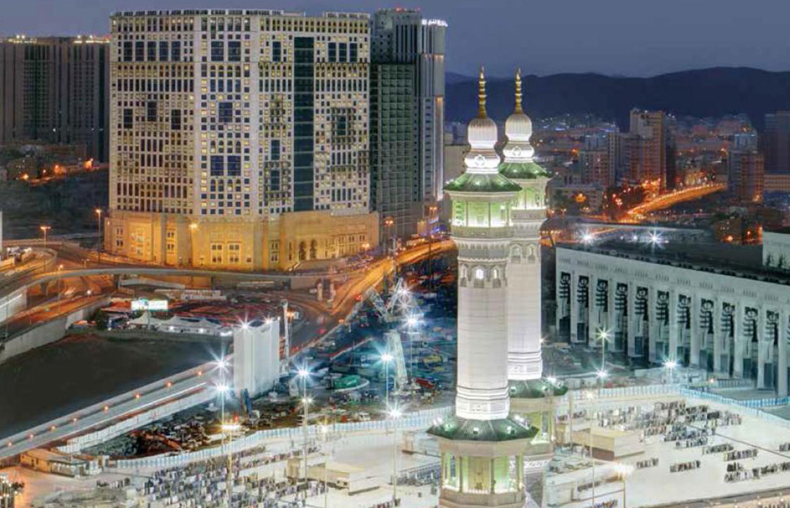 The Anjum Hotel Makkah Mecca in Saudi Arabia lit up at night surrounded by busy streets