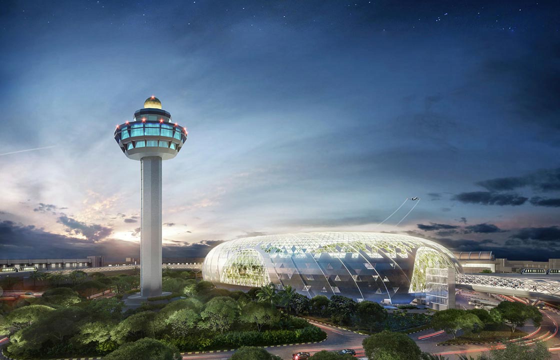 The airport control tower at the Changi Airport in Singapore overlooking the airport as it goes dark