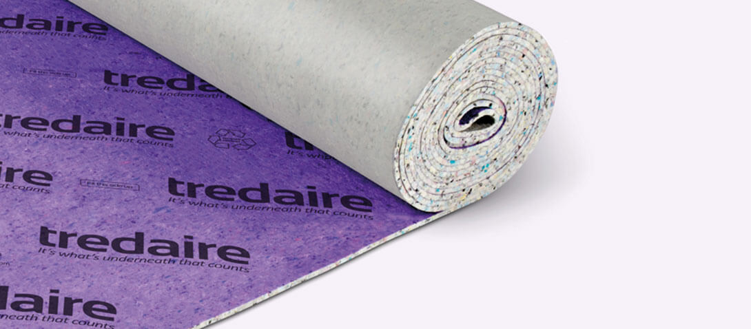 A roll of purple tredaire underlay on a white background